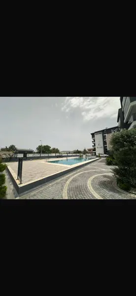 KUŞADASINDA 3+1 KAPALI MUTFAK EBEVEYN BANYOLU HAVUZLU GÜVENLİKLİ SİTEDE SATILIK
